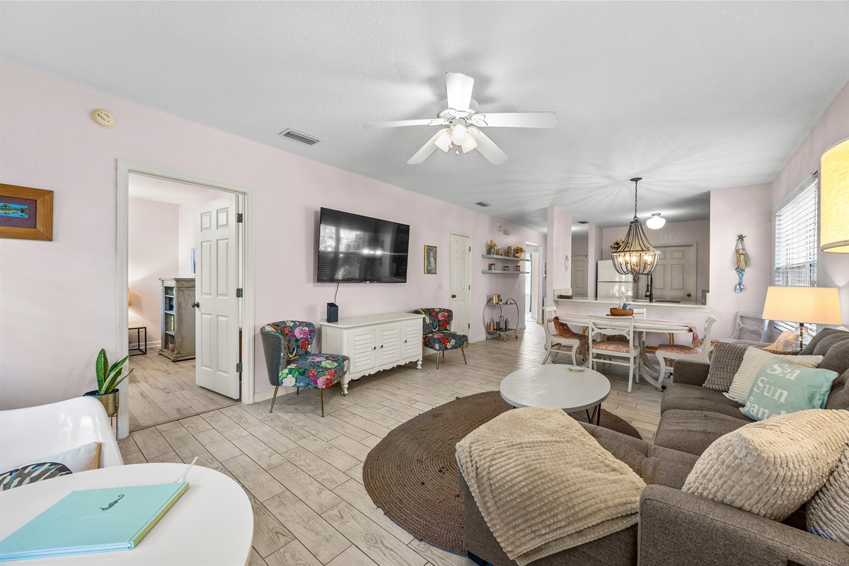 Bright and inviting living area with large ROKU TV for movie nights or family gatherings.