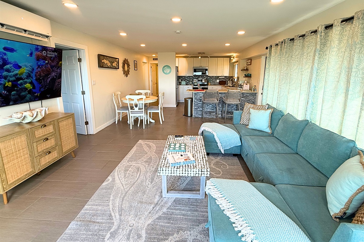 Open floor plan with living, kitchen and dining area