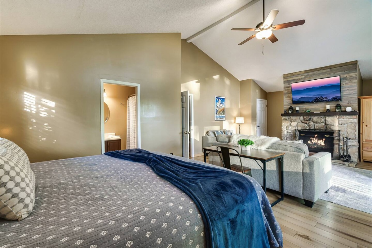 Private master bedroom suite on the top floor of the chalet. It includes a desk as a dedicated work space. Take in the mountain scenery while you work (if you must)!
