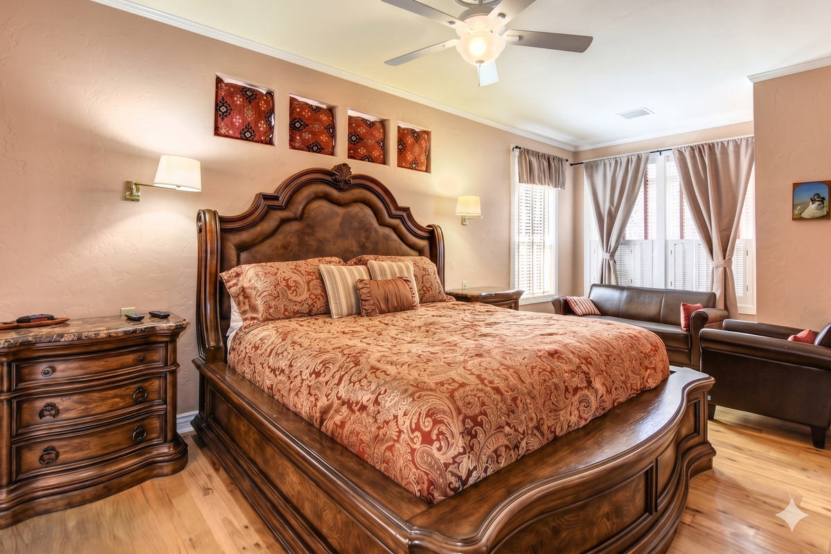 King-size bed with vibrant textiles and artistic accents.