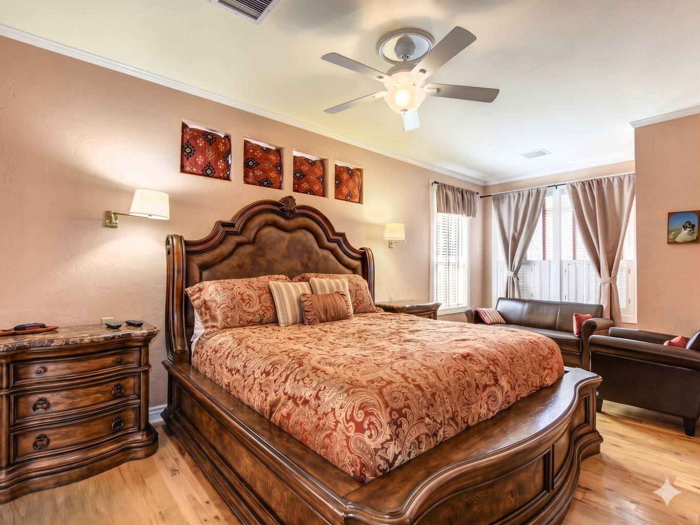 King-size bed with vibrant textiles and artistic accents.