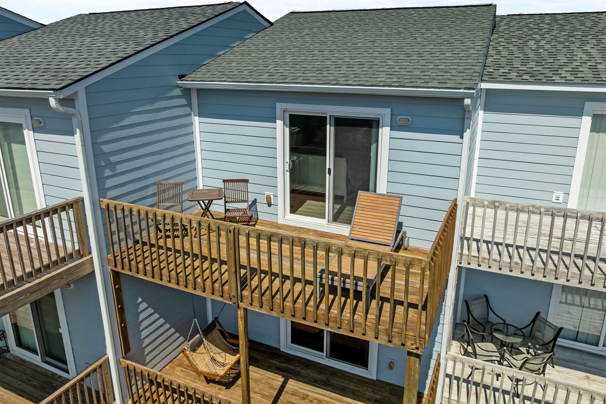 Private upper deck with seating and sliding door access
