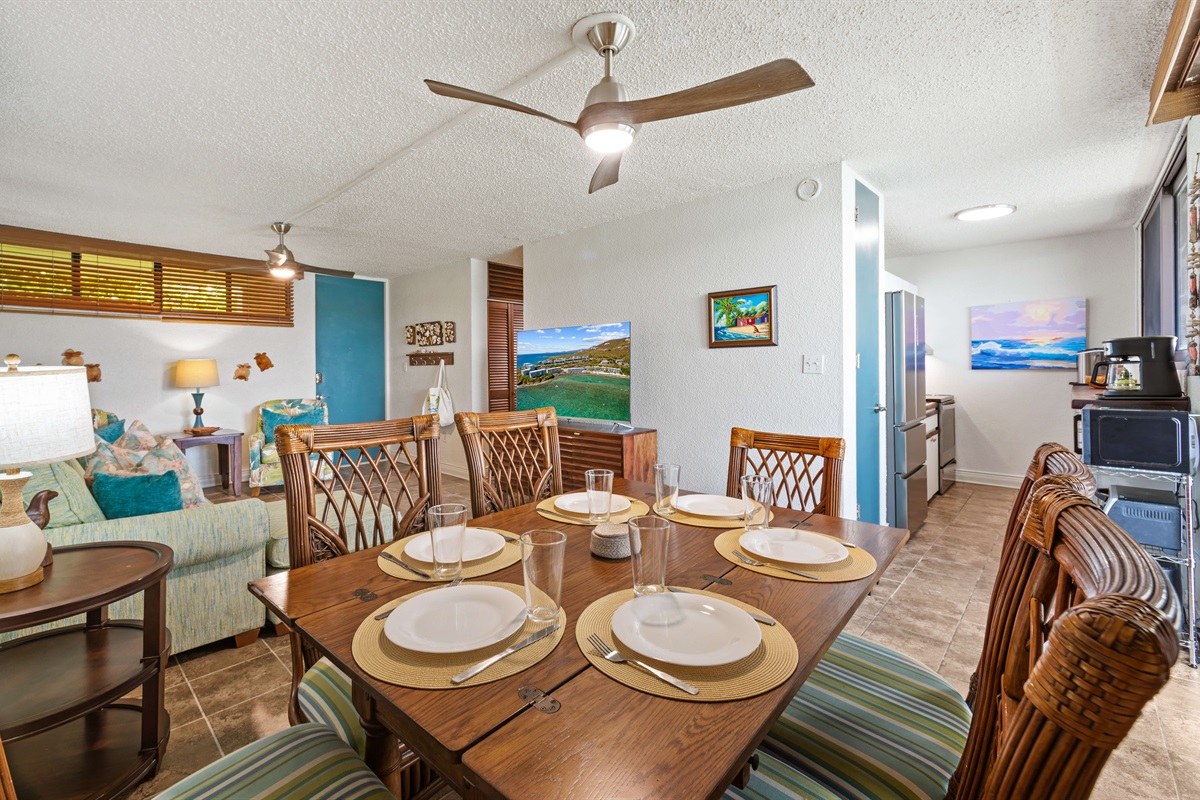 Open layout connecting the living room and dining room and kitchen just around the corner