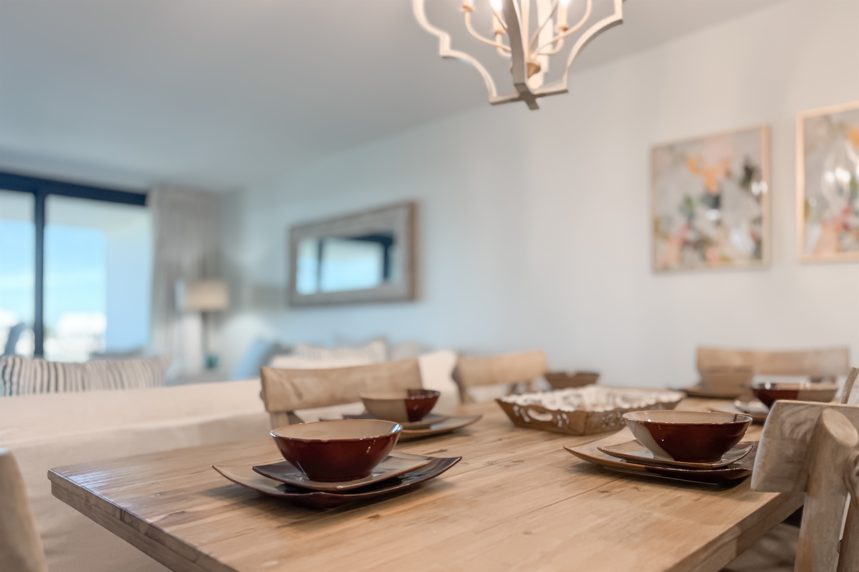 The natural textures and soft light create a serene atmosphere perfect for enjoying meals with a view.