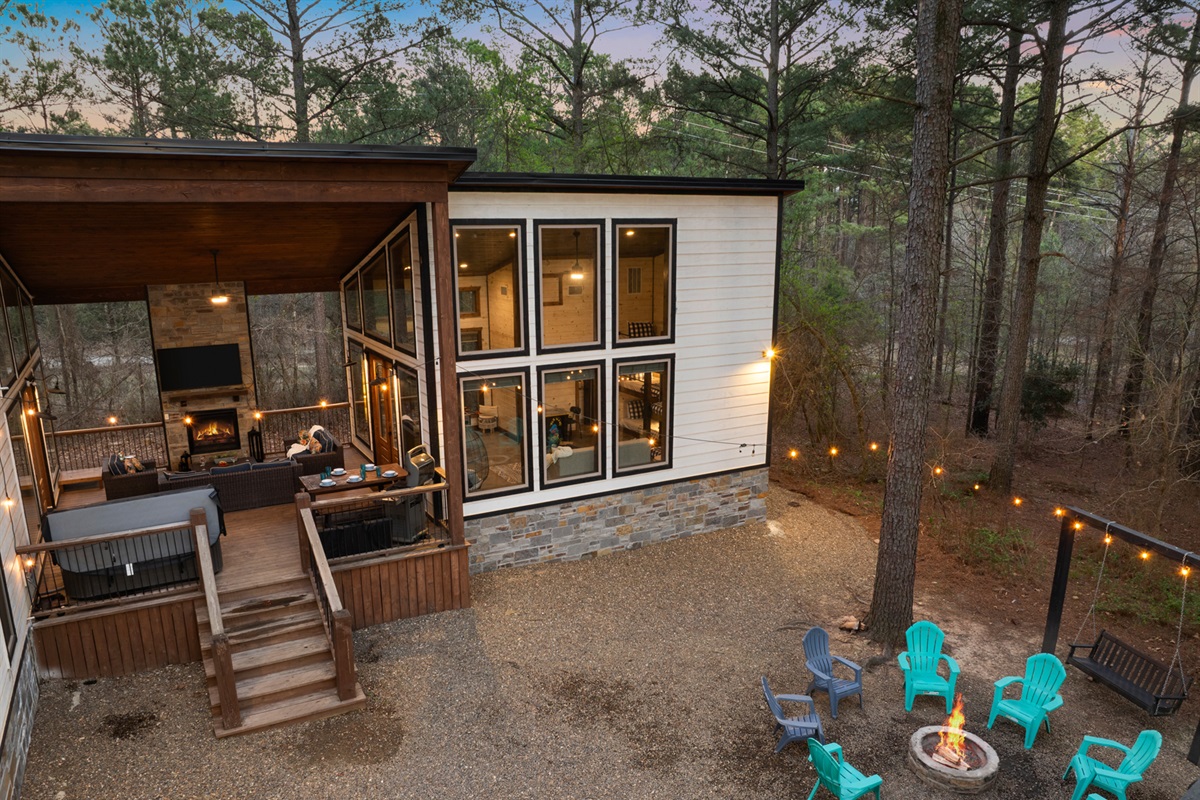 Your new favorite spot! This covered deck is a guest favorite because everyone can connect in one dreamy covered spot! The hot tub sits right here under full cover, so you can soak while the fireplace glows+ the game plays on the outdoor TV.
