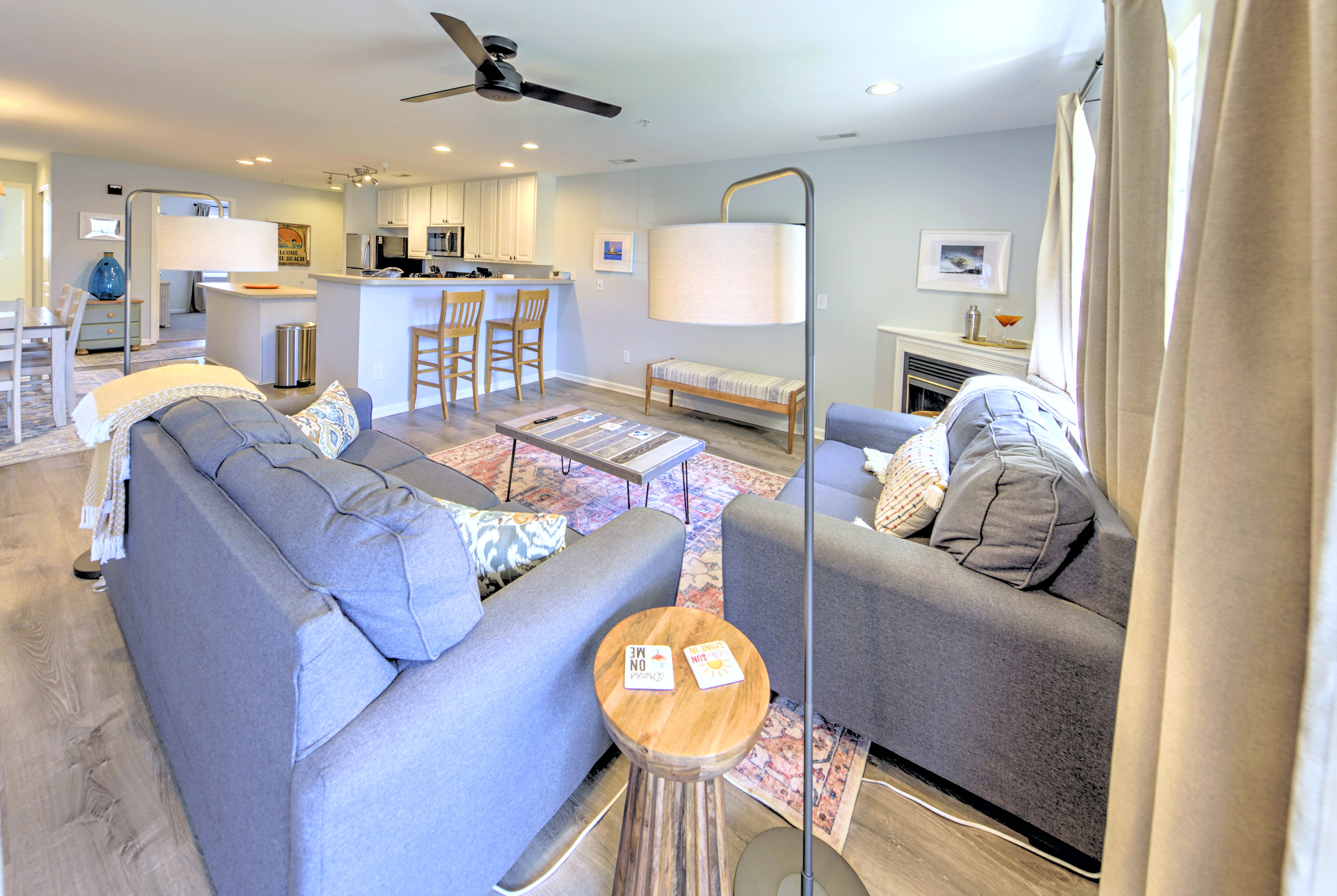 Living Room: Bright and airy space perfect for unwinding after a day at the beach with stylish decor and inviting seating!