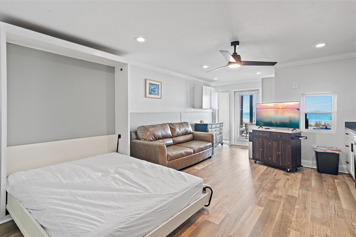 The 1st Floor features another Living Room w/ 50" Smart TV, Pre-Loaded Game Console, Murphy Bed, a Kitchenette, and Patio Access - Great for the Kids or Two Families!