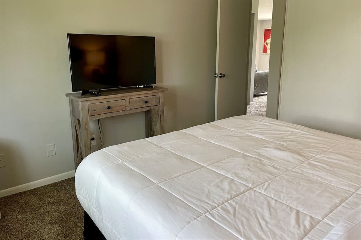 Bedroom 1 equipped with 43" smart tv.