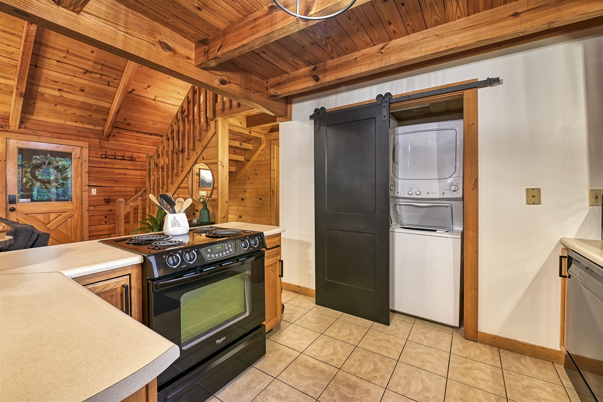 Washer and dryer in kitchen. Pantry cabinet has space to store your groups food.