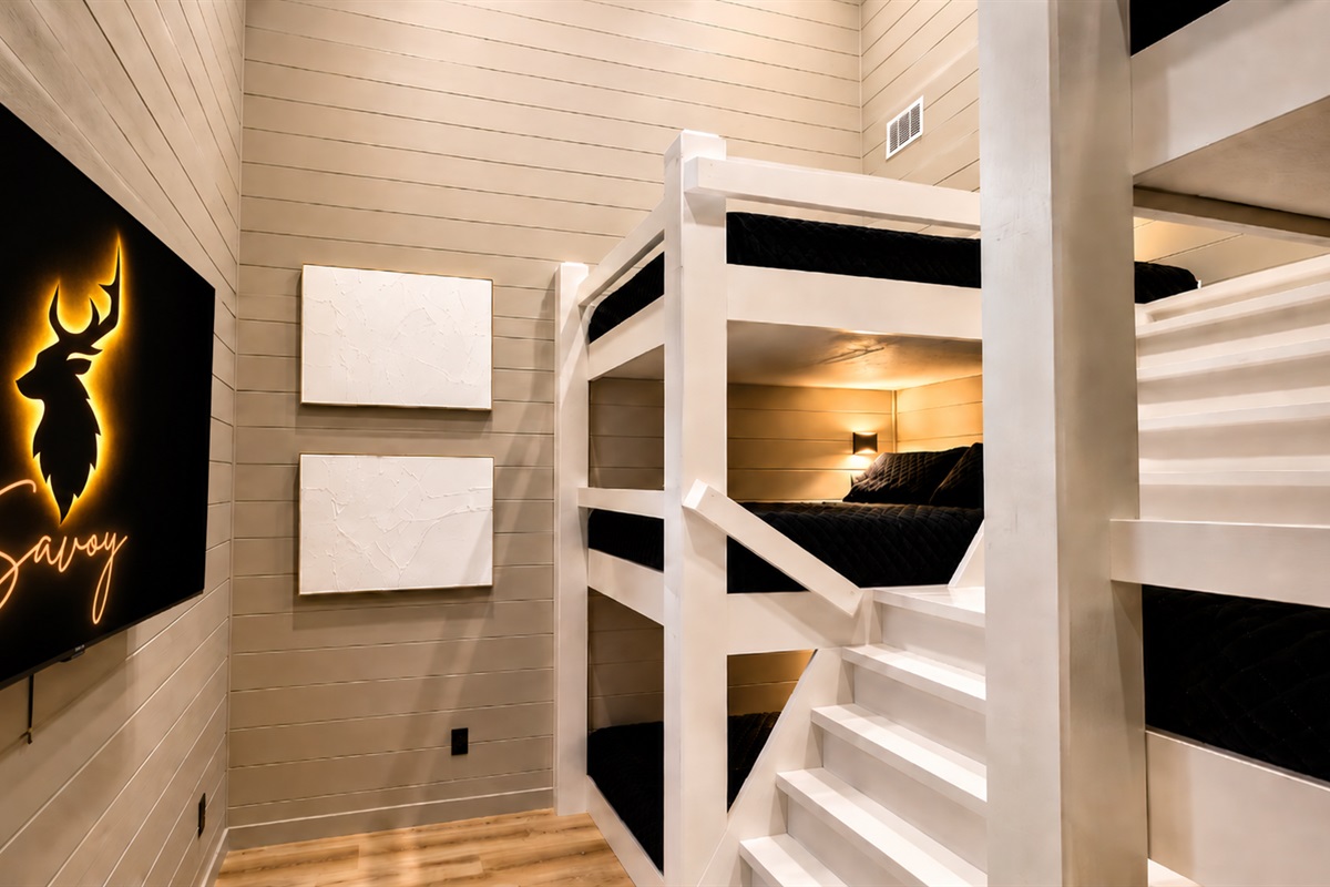 Bunk Room: Fun-filled nights await in this stylish space with plush bunks and entertainment galore!