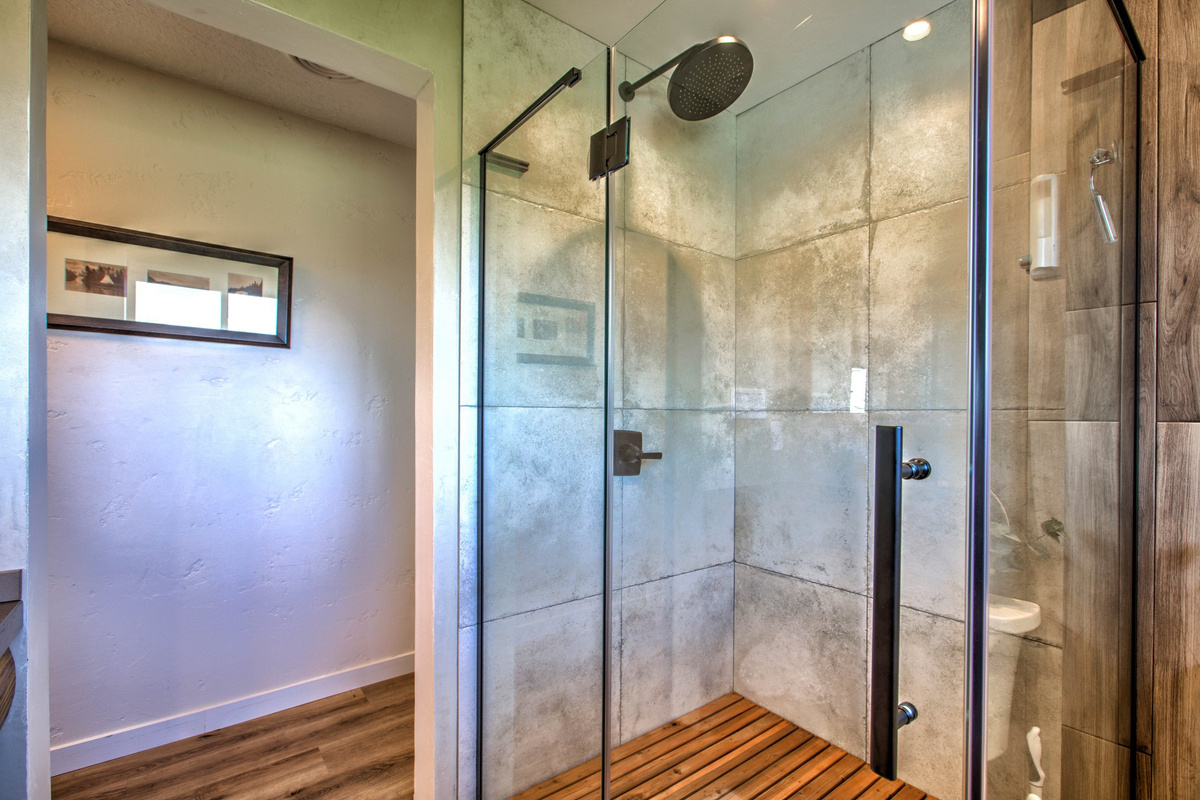 Walk-in glass shower with clean modern finishes