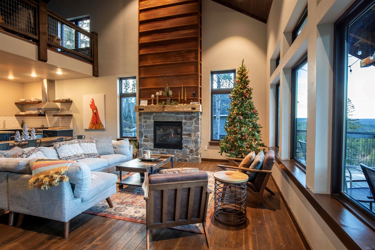Our open-concept living area comes alive for the holidays with a glowing tree, forest views, and plenty of space to gather, share meals, and enjoy Christmas morning together.