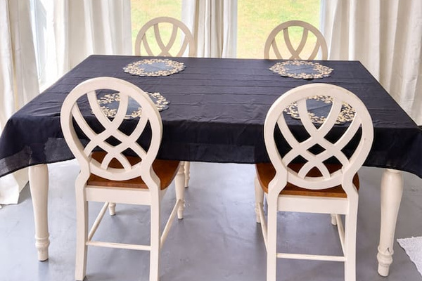 Dining table located in a fully air conditioned sunroom, with a backyard view. (This is connected to the kitchen)