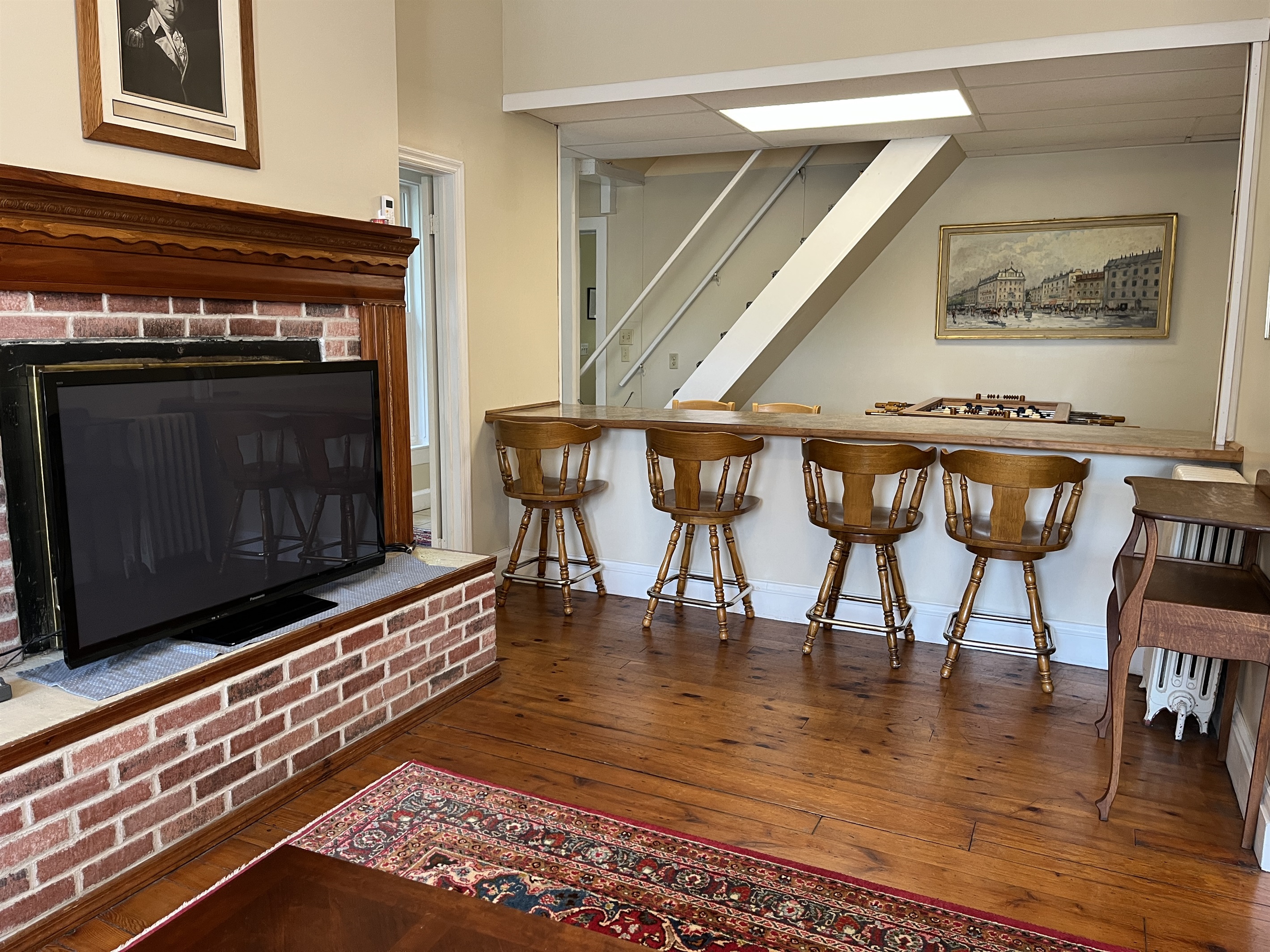Living room with bar area and seating.