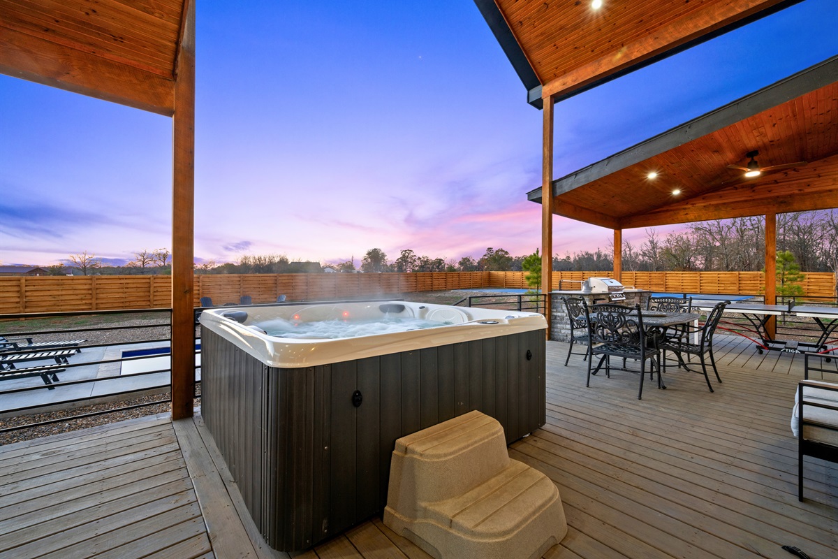 A private hot tub sits right off the deck, offering a quiet place to unwind while soaking up the peaceful scenery.