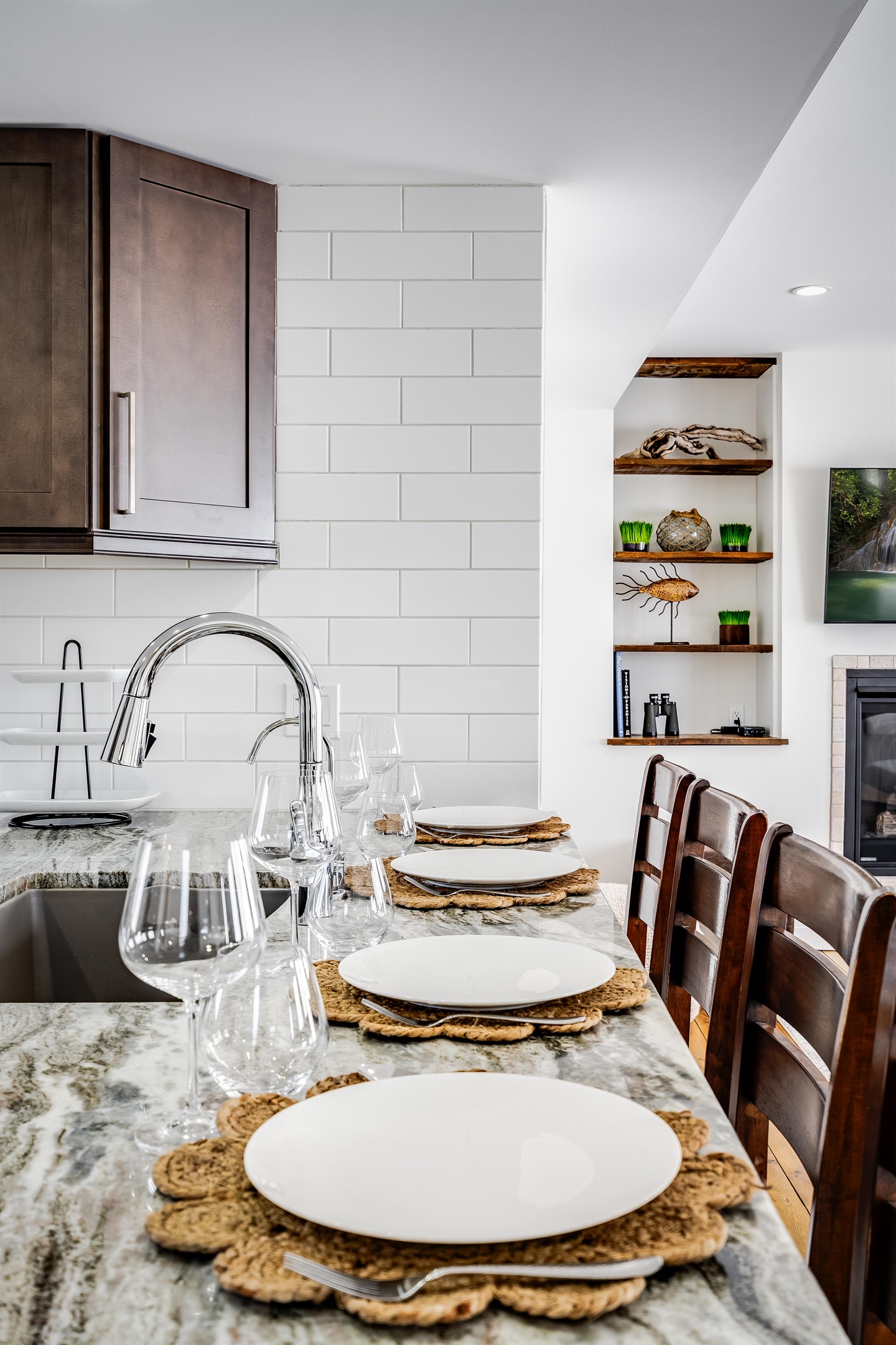  White walls shimmer like morning light, grounded by wood’s steady embrace.