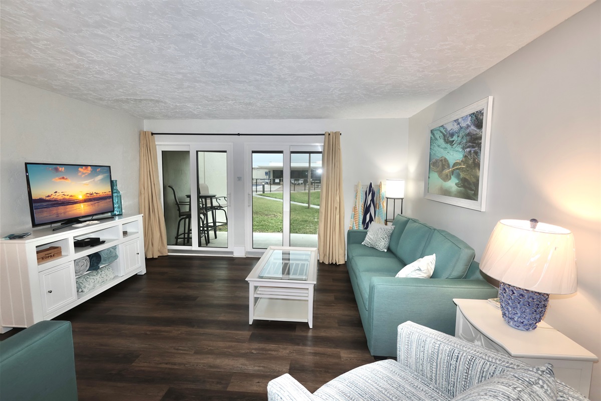 New sleeper sofa in living room with views of the pool