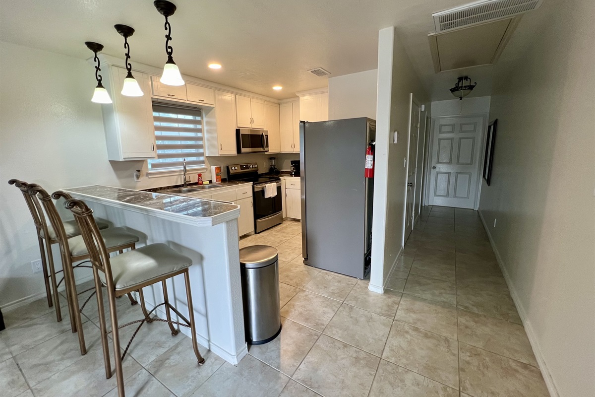 Kitchen and Hallway - washer dryer is located in a closet in the hallway