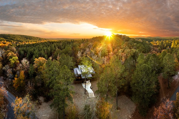 Surrounded by forest and glowing at sunset, this is where your quiet cabin getaway begins