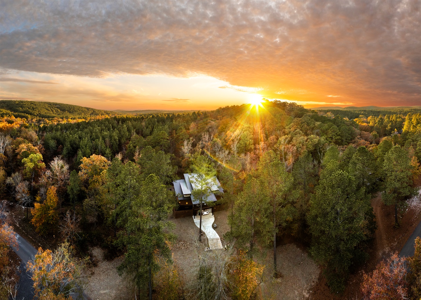 Surrounded by forest and glowing at sunset, this is where your quiet cabin getaway begins