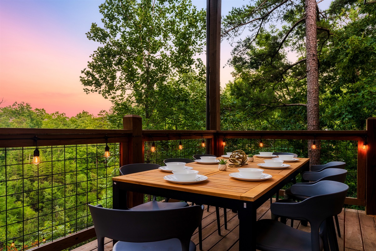 Dine on the back deck with string lights and nature views