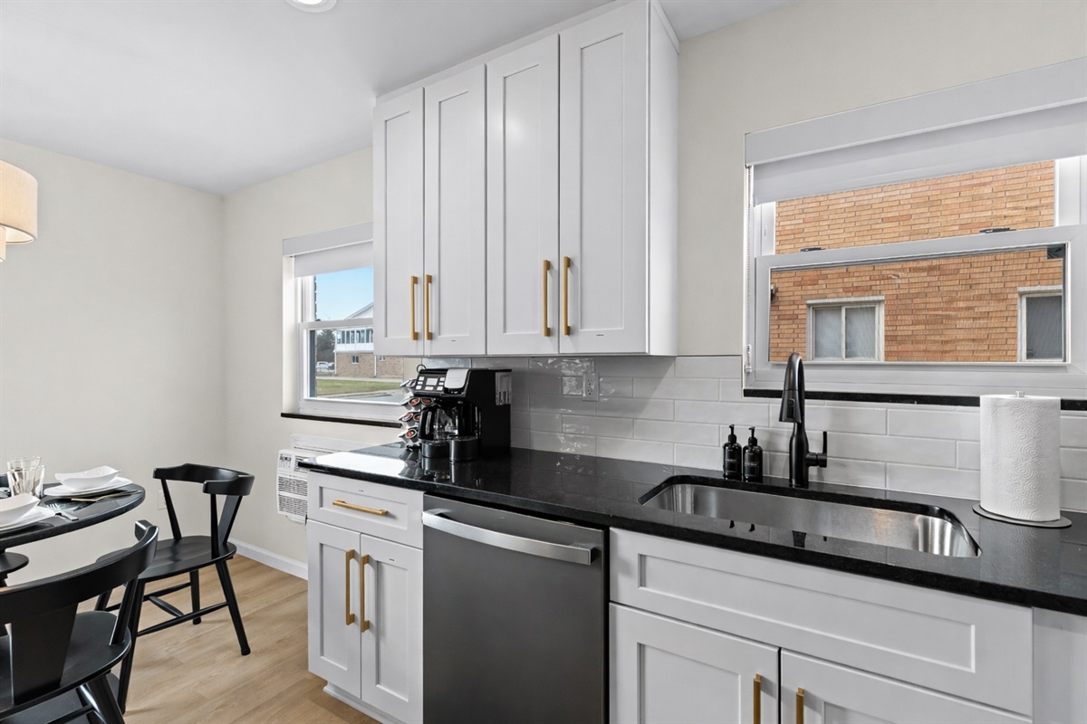Bright kitchen with sleek countertops, modern cabinetry, and thoughtful details—perfect for cooking, coffee breaks, and everyday convenience.