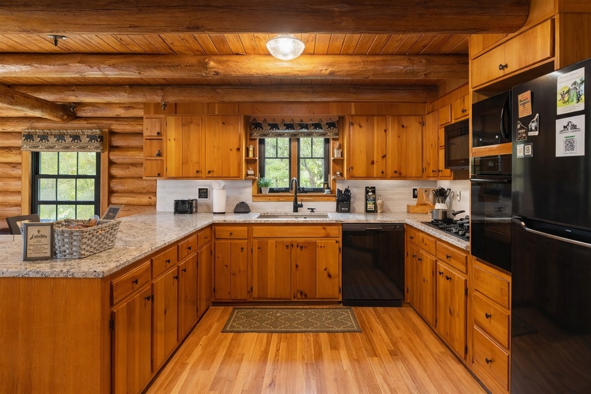 Fully stocked and full of charm—our rustic kitchen makes it easy to cook up family meals, morning pancakes, or a pot of cocoa after a day in the great outdoors.