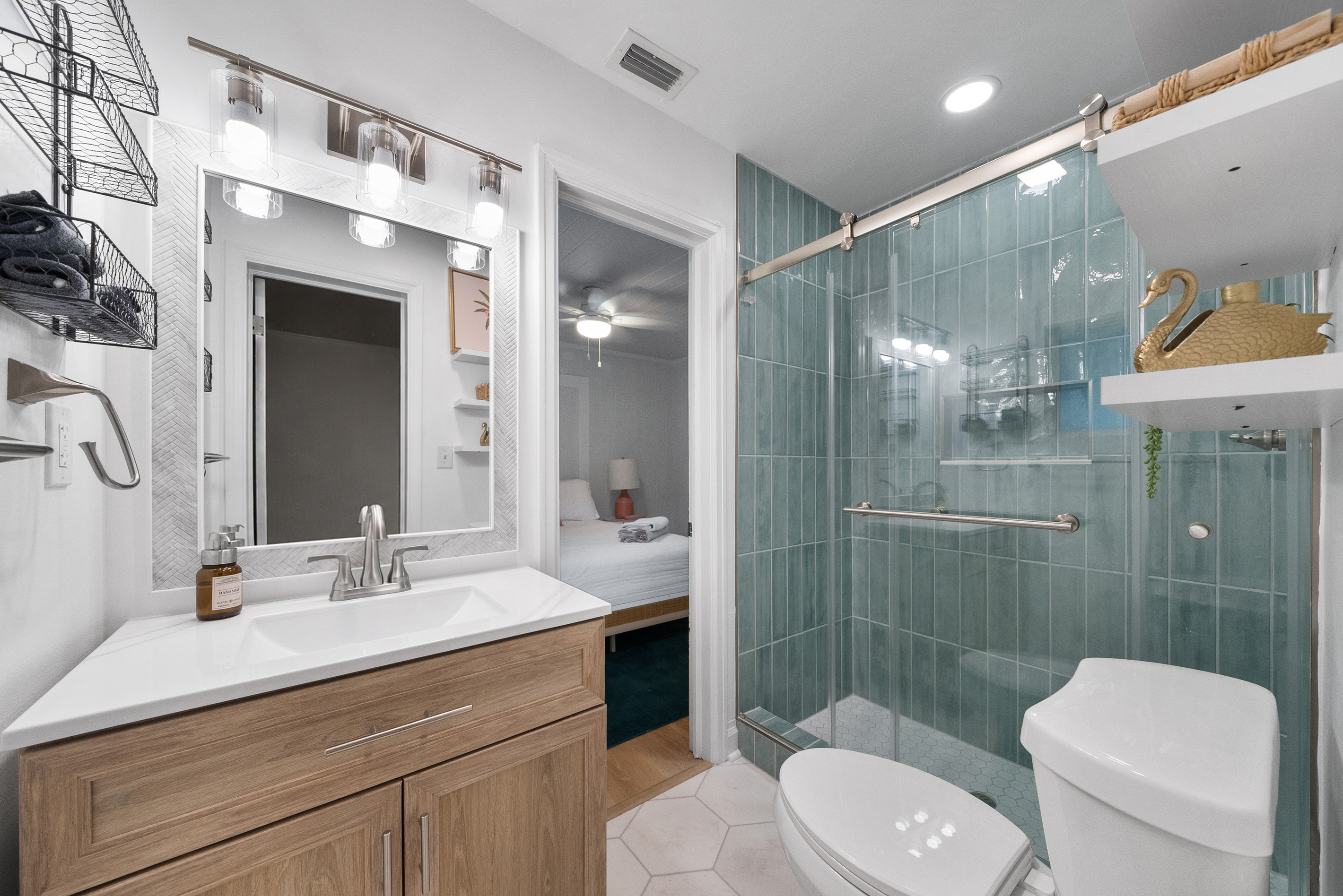 Bathroom #1, Jack and Jill — freshly renovated with a walk-in glass shower wrapped in sea-glass tile