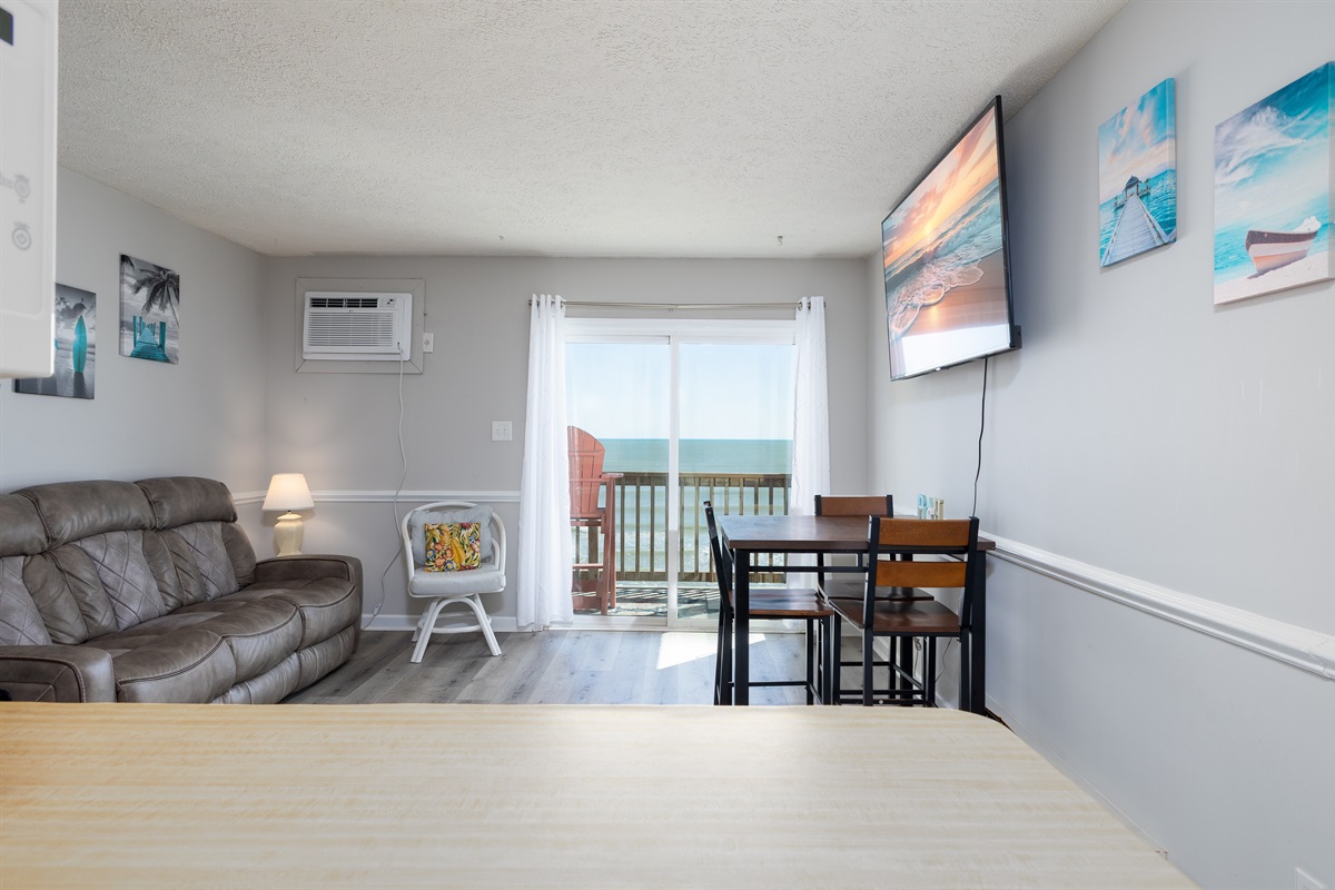 Comfortable and open living room with balcony access