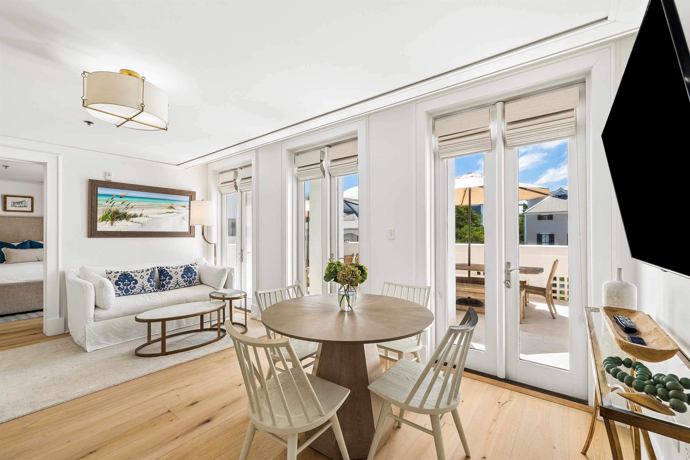 The living and dining area offers plenty of space for four to relax and enjoy a meal.