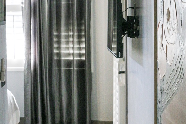 wall-mounted TVs in all 3 bedrooms