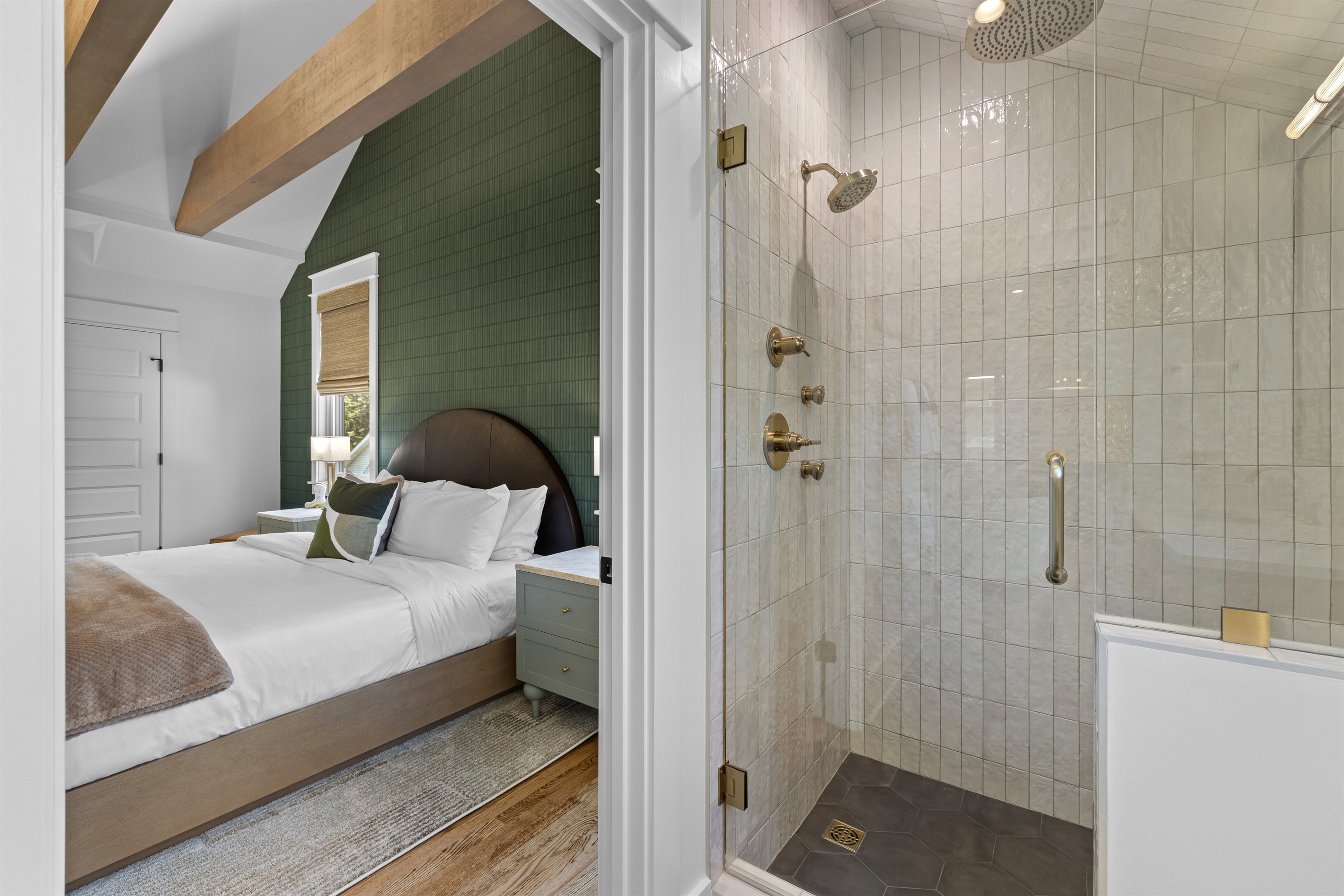 Spa-style bathroom with dual shower heads and body sprays.