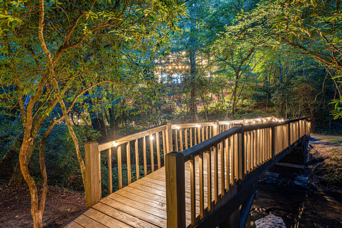 A magical walk across your private bridge leads to the peaceful Cartecay River.