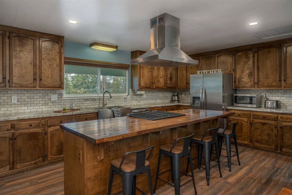 Large open kitchen-stocked with everything you may need to cook up a delicious meal. Grocery store is less than 1 mile away.