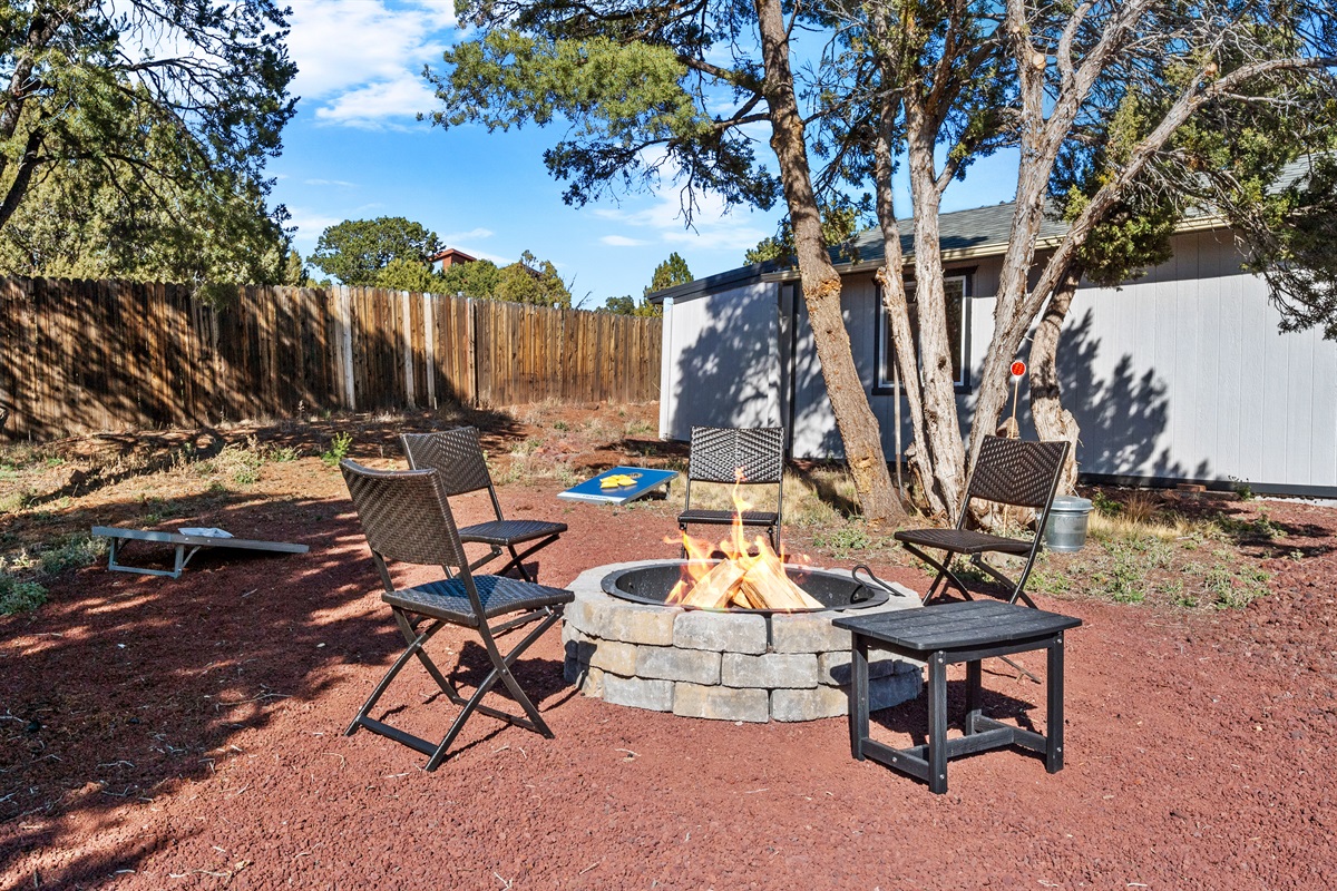 Cozy up by the crackling firepit, surrounded by whispering juniper trees and open skies! Whether you're roasting marshmallows, swapping stories, or just soaking in the warmth, this outdoor haven is made for magical moments and endless laughter!