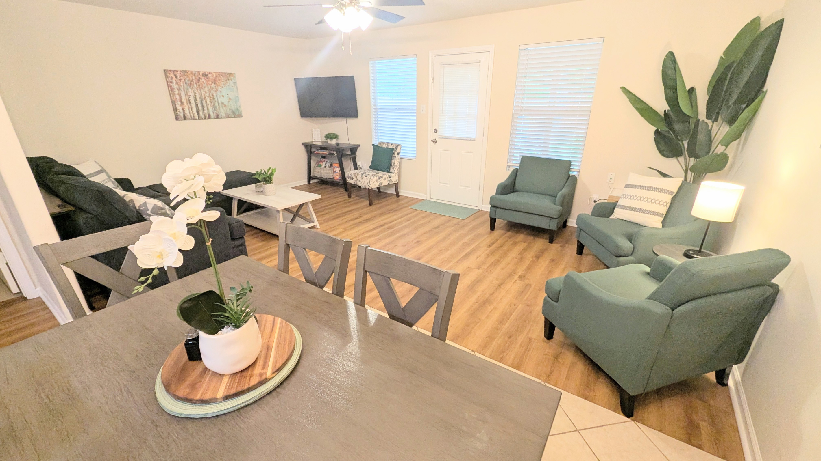 Multiple seating options in this connected dining and living space.