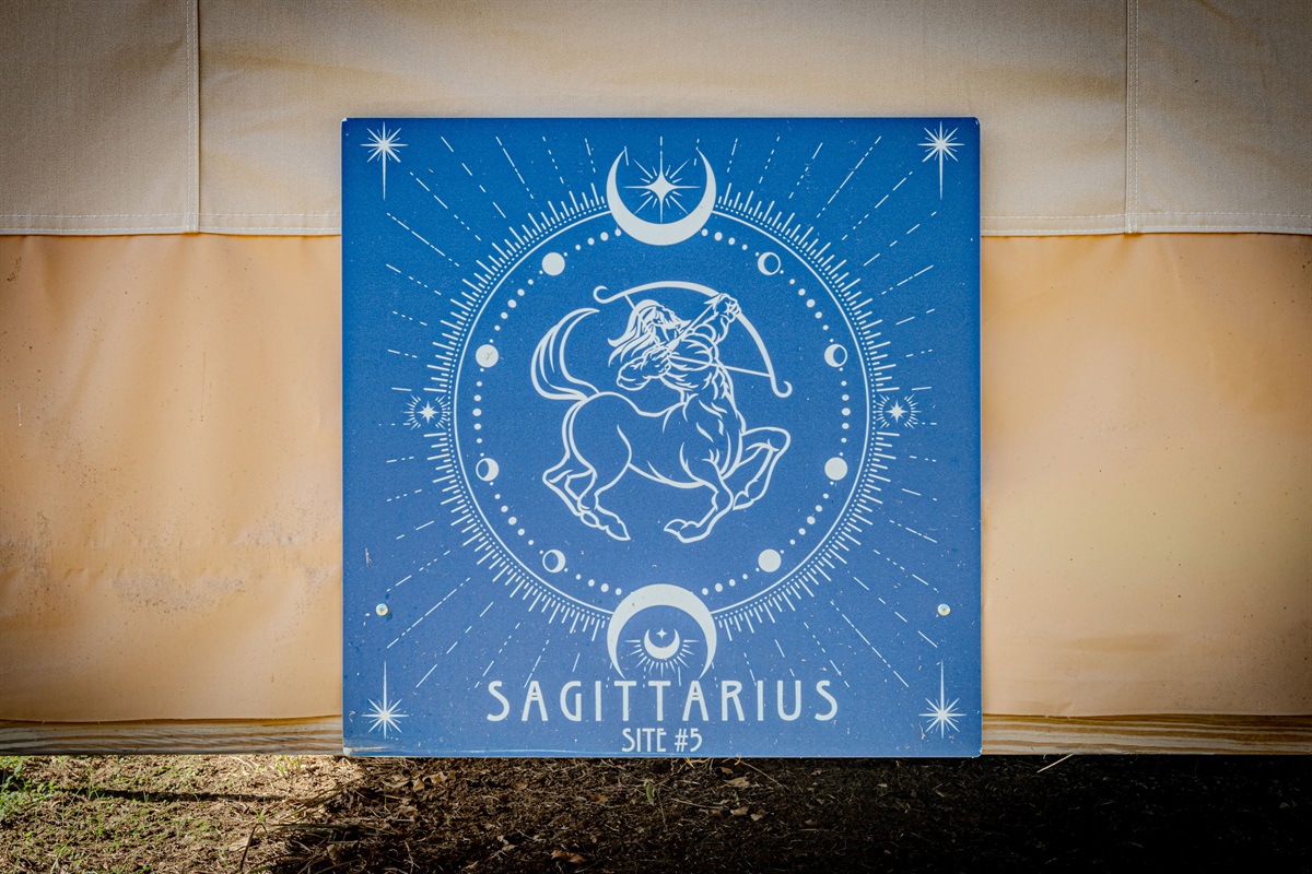 When you see this sign on the back of the tent, you'll know you've arrived.