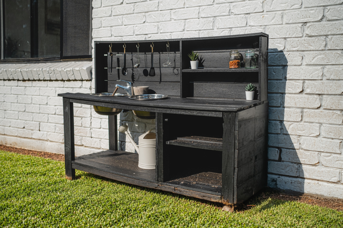 A thoughtful outdoor play feature giving younger guests their own space for hands-on fun.