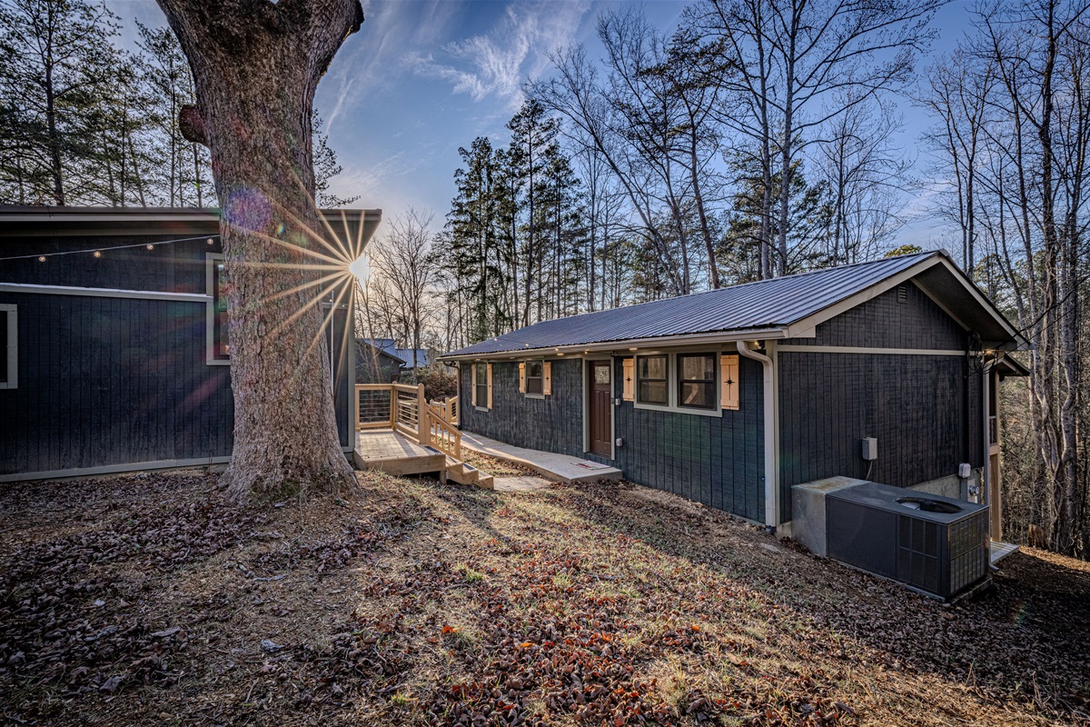 Retreat to the outdoors and soak in the tranquil atmosphere of our secluded, wooded backyard at dusk.