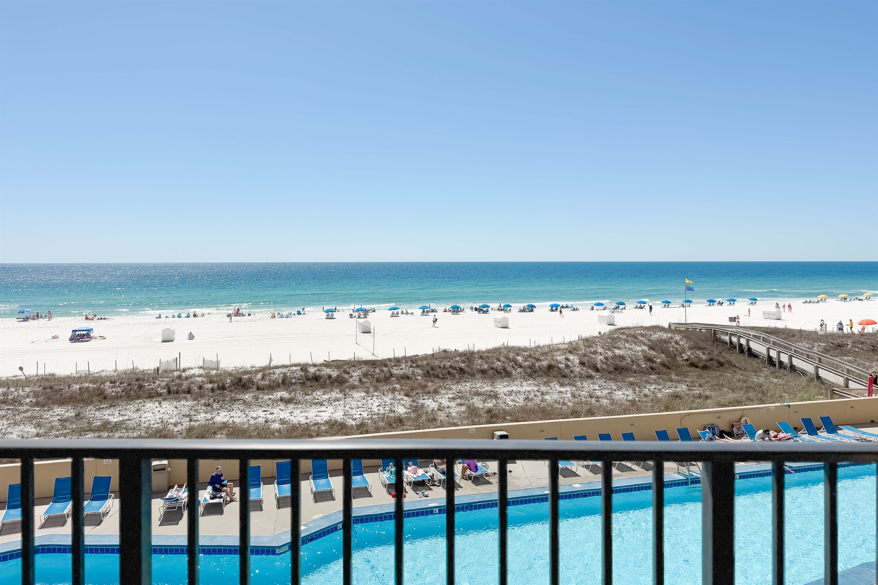 Elevated relaxation. Experience the best of beachfront living from your own private balcony. Unobstructed views of the sand, surf, and pool await.