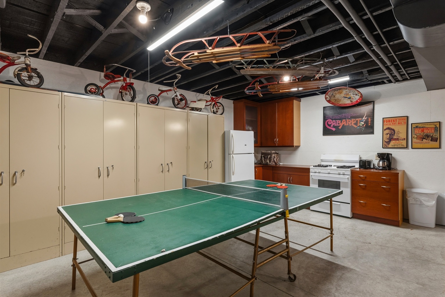 Lake house game room w/ ping pong table & vintage-style decor