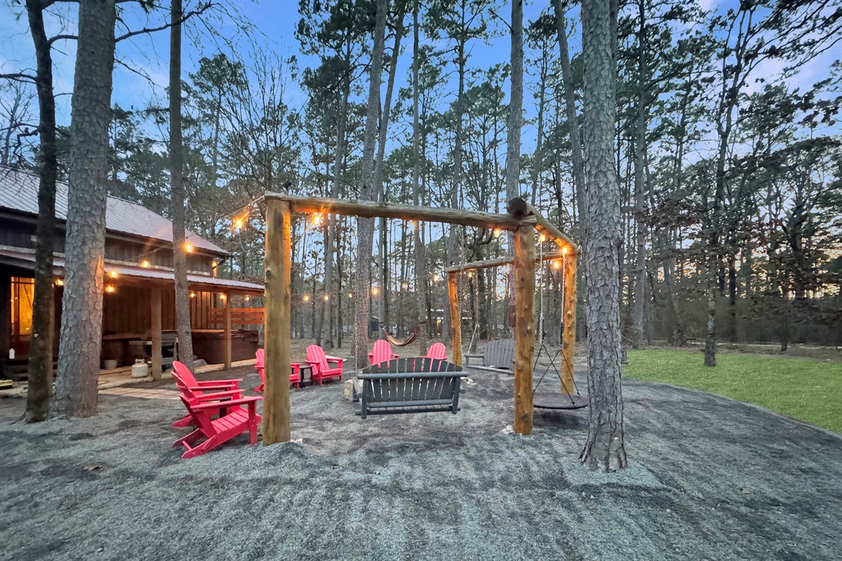 Gather around the custom fire pit swings - your new favorite family tradition starts here.