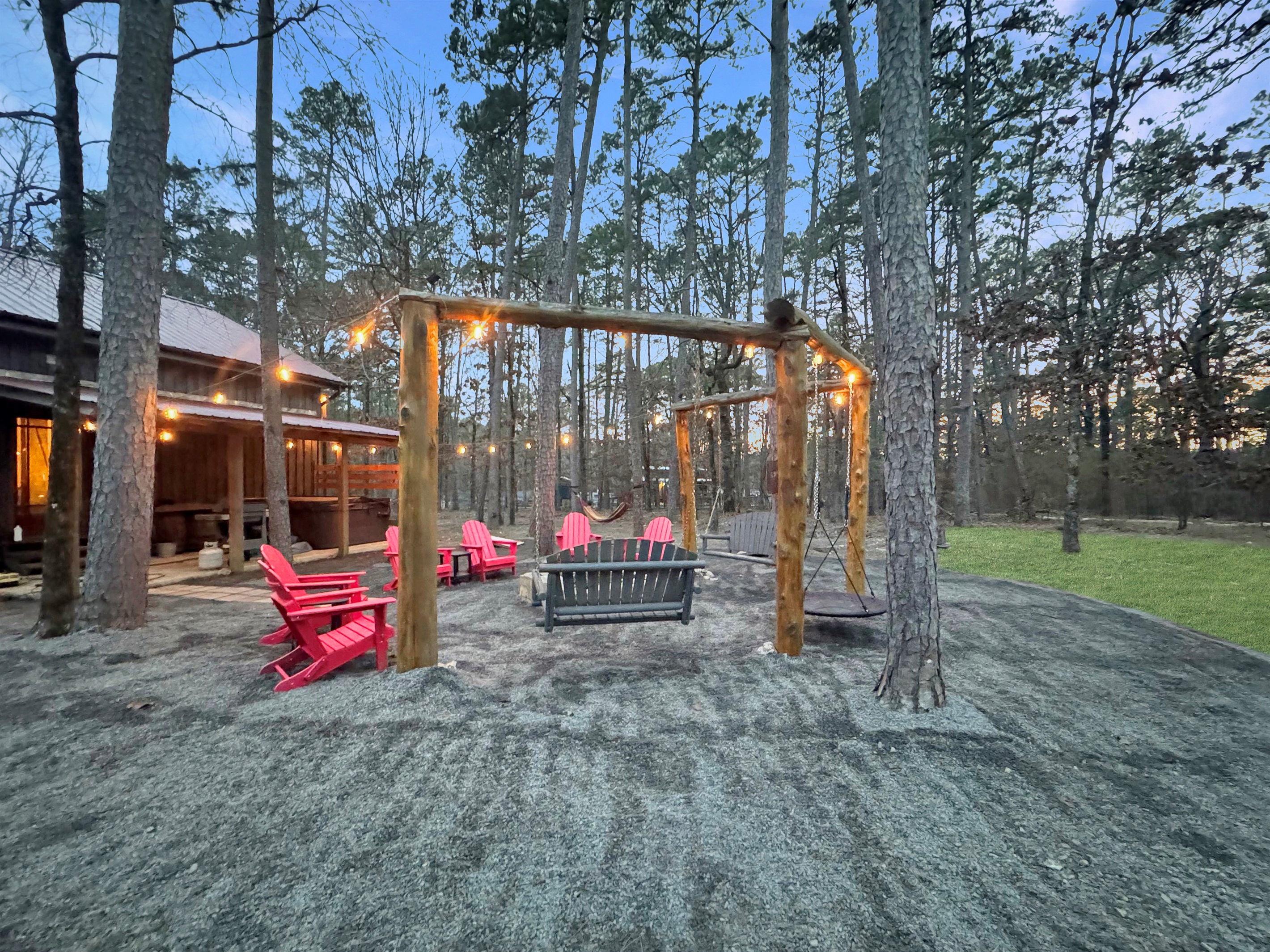 Gather around the custom fire pit swings - your new favorite family tradition starts here.