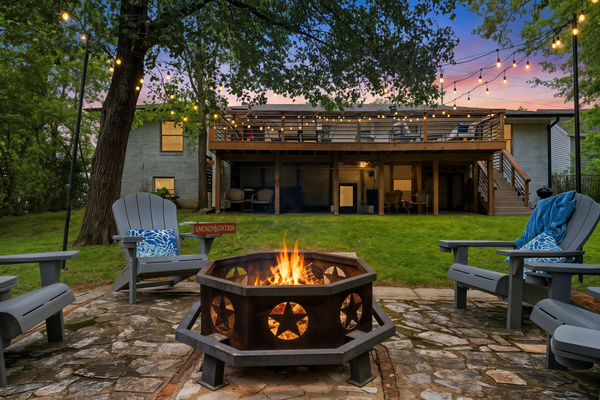 Come home to string lights glowing over the deck — Hot Springs Breakaway