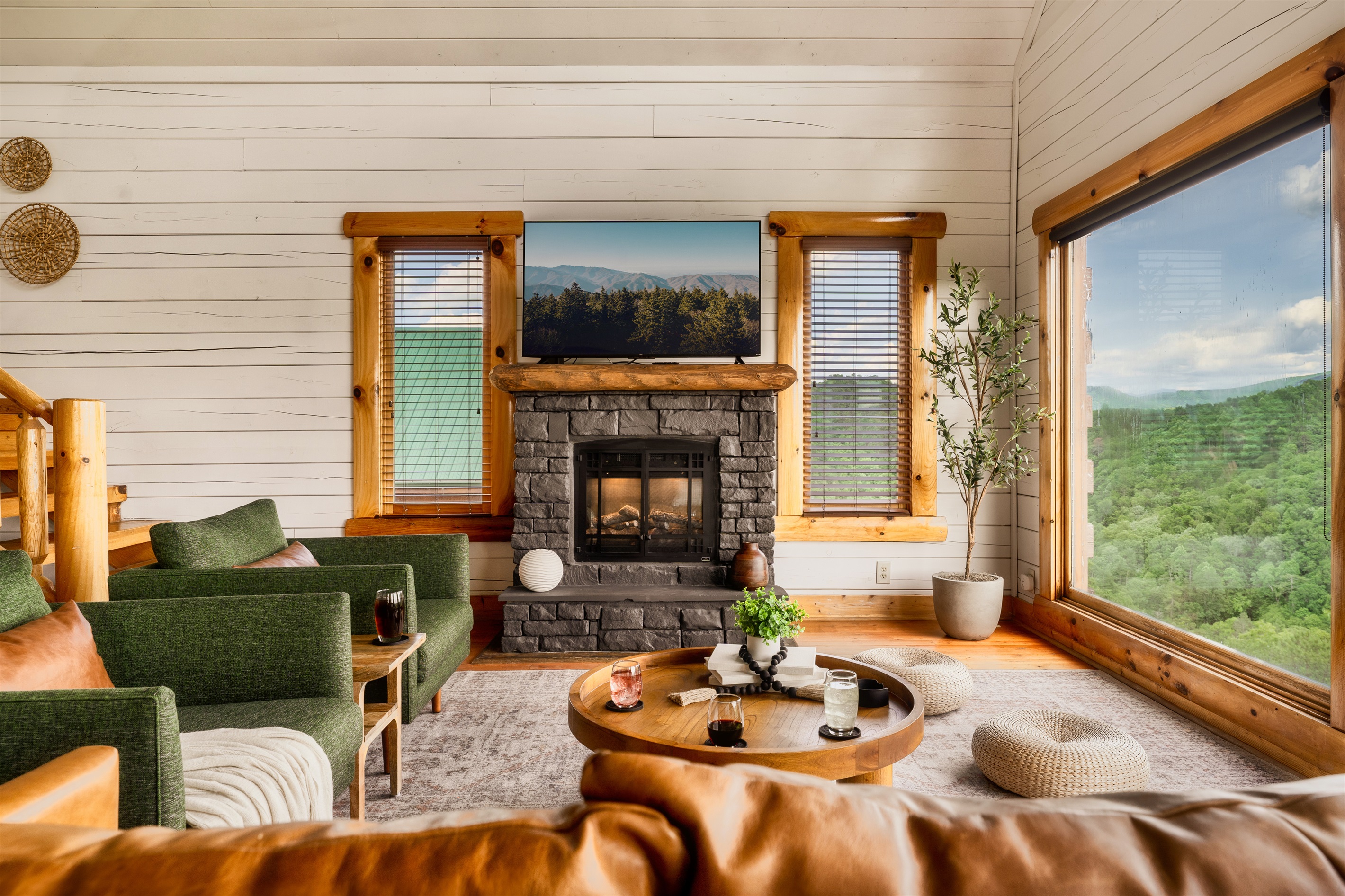 Cozy up by the fireplace in our inviting living room, where warmth and comfort await. Your home away from home is ready to embrace you with open arms.