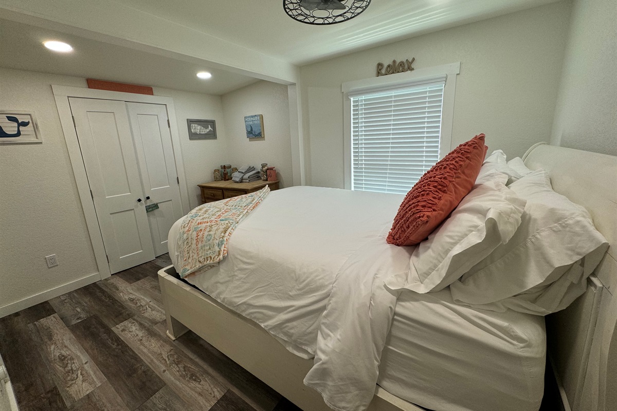 Second bedroom with queen bed and smart tv