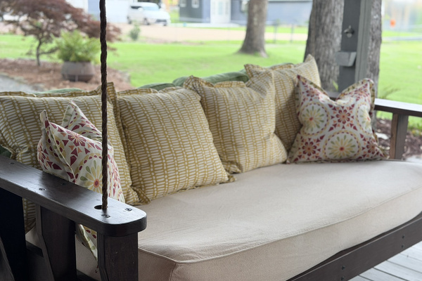 Comfy swing beds overlooking the lake — a quiet spot to relax in the shade