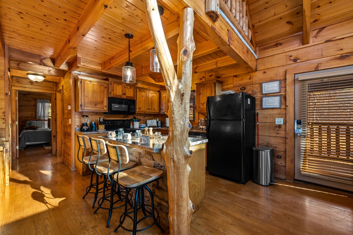 The open kitchen layout with island seating for four offers both functionality and flow.  Perfect for cooking, dining, and spending time together.