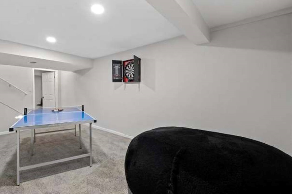 Ping pong and dart board in the basement 