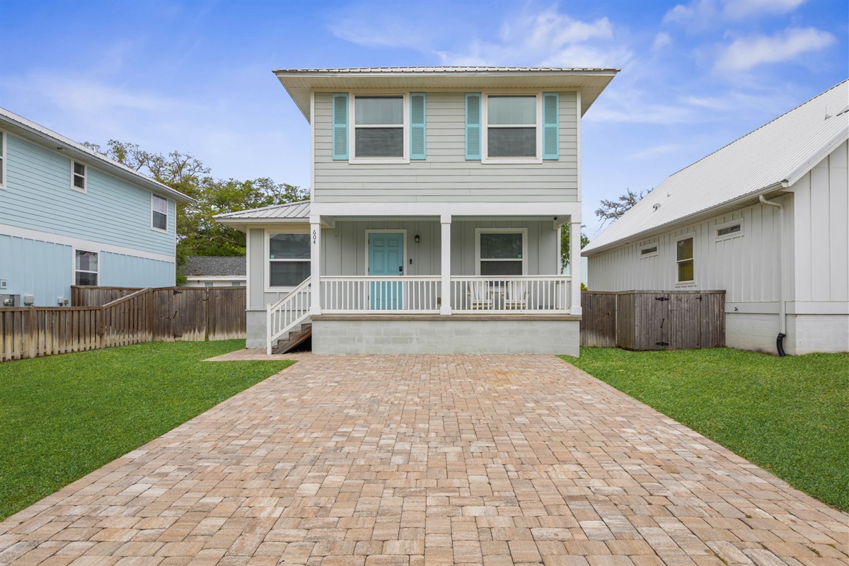 Spacious driveway and private home layout provide added convenience and privacy.